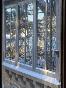 One of our favorite photos is the one taken of this dining room double pane window which faces south. One can see the beautiful and clear reflection of Seal Harbor and Sutton Island in the glass.