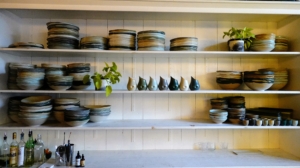 Here are some of Connor's handmade ceramic plates displayed prominently on the shelves and used for "Sunday Supper" meals.