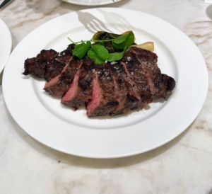 Among the other dinner menu items is our Prime New York Strip Steak with braised leeks and watercress.
