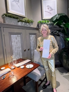 Here I am holding one of the menus in a room painted in, can you guess? Bedford gray of course. The prints on the walls were also inspired by photos decorating the rooms in my own home.