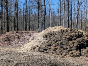 Here are our main piles of debris – leaf mold, clippings, and organic matter made up of manure and other biodegradable materials. Most of these piles are combined and also put through the tub grinder - twice.