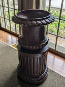 This is one of two antique urns made of the same material used to manufacture sewer pipes. Sewer tile pottery was made by pipe workers who used leftover clay at the end of the work week to create sculptured forms such as this planter. Over the years, I've collected a few pieces. Made mostly in the late 19th and early 20th centuries, these were valued for their color, their rarity and their form. I just love these industrial looking vessels.
