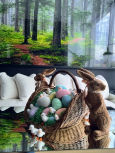 A large basket filled with eggs and flanked by bunnies sits on Kevin's coffee table.