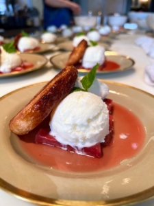 Each palmier is served with a layer of baked rhubarb, sorbet, and a sprig of mint.