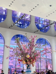 The arched windows were brightly lit with shades of blue. When turned on, they transform into video wall installations projecting views of Central Park and the Manhattan Skyline. They are actually mirrors when turned off.