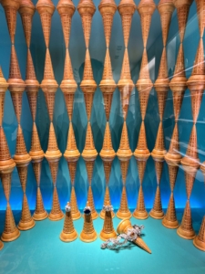 Here, an archive display of jewelry is surrounded by ice cream cones.