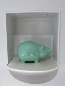 Also on the same floor, lots of Tiny Tiffany Piggy Banks - this one in green earthenware.