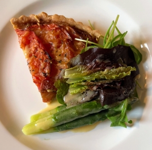 Here is a plate ready serve - a big slice of heirloom tomato, comté and Gruyère tart with jumbo green asparagus, a garden salad, and honey-lemon dressing.