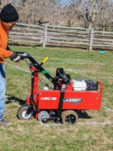 Next, my outdoor grounds crew foreman, Chhiring, cut the sod around every outlined space. This is our new Classen Pro HSC18 sod cutter - it cuts so precisely in so little time.