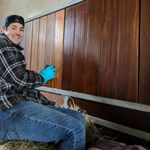 Here is Juan cleaning another area of the stall - one can see how different it looks after it is treated with Furniture Tonic. It restores the luster of the wood. And, the tonic is made from natural, non-toxic ingredients that are friendly to the environment.