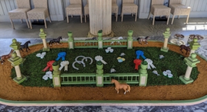 Here is the racetrack centerpiece in the Carriage House. I had the miniature steeple fencing already, but we used crushed Biscoff cookies for the track.