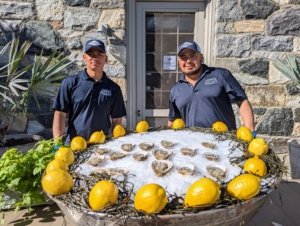 And here are our friends from Copps Island Oysters ready to shuck and serve. We ordered more than 300 oysters for the event - and all of them were devoured.
