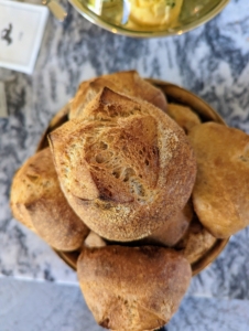 Chef Pierre and his team baked dozens of sourdough boules. A boule, from French, meaning "ball", is a traditional shape of French bread resembling a squashed ball.