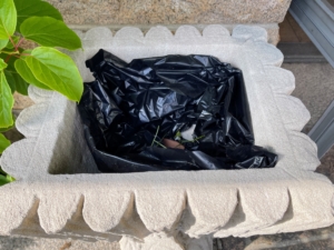To protect the rather porous and fragile pots, I like to line them with garbage bags, so the pots don’t soak up too much water. The garbage bags have drain holes at the bottom and are neatly tucked inside the pot, so they are not visible.