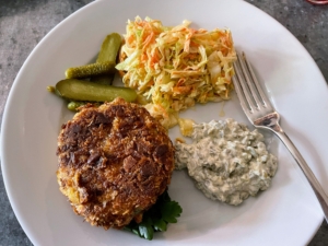 Lunch that day was crab cakes, tartar sauce, homemade coleslaw and cornichons. Cornichons are tart and sweet, with a briny flavor. They're crisp and crunchy, but less sour than traditional dill pickles.