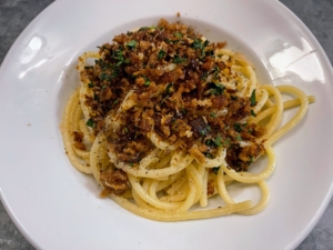 ... and bowls of bucatini pasta with anchovies, roasted garlic brioche bread crumbs, parsley, and olive oil.