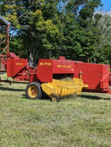 A hay baler is a piece of farm machinery used to compress a cut and raked crop into compact bales that are easy to handle, transport, and store. I am fortunate to have all the necessary equipment to process the hay in my fields.