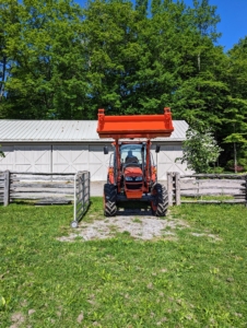 And then he heads out to the pasture. The other end of the tractor has our trusted Kubota L1154 front loader that helps us transport so many things around the farm and cuts down plenty of time going back and forth to the Equipment Barn.
