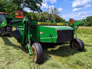 This is our mower-conditioner. Mower-conditioners are a staple of large-scale haymaking. It cuts, crimps, and crushes the hay to promote faster and more even drying. It is the first step in the hay baling process.