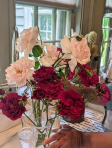 In this vase, Elvira mixes deep red roses with a few cream to light pink colored blooms. When displaying roses, be sure to keep them away from heat and bright light, which will shorten vase life.