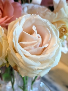 I like arrangements to be done by color - this arrangement includes many of the light colored roses.