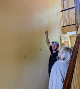 Here I am talking to Alex about the precise positioning of one screen, which includes six panels. We consider height, width, and placement next to any moldings.