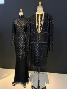 The exhibit features beautiful pieces in a wide array of fabrics - some classic and elegant, others more colorful and intricately threaded. This black ensemble and dress are both from House of Chanel, autumn/winter 1986–87.