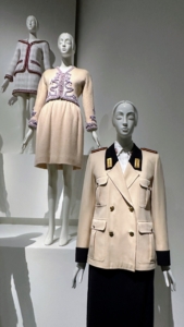 At the top is a suit from House of Chanel, 2017–18 métiers d’art. The middle is a suit from House of Chanel, spring/summer 1988 haute couture, and the bottom is called his “Policewoman,” an ensemble from the Fendi, autumn/winter 1983–84 line.