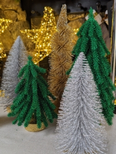 During the holidays, I always decorate my home with lots of trees - big trees, tabletop trees, in a variety of colors that match the rooms in my home. Here are my bottle brush trees in green, gold, and silver. This six-piece set shows the trees in various shapes, but one can also adjust the branches to make them appear more wide or more slender.