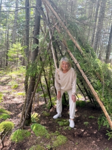 On another day, we had a survival expert come out to teach the children how to survive in the woodland. Here I am in the teepee the children built.