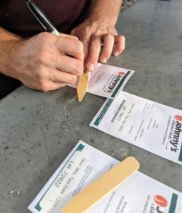 Here, Ryan writes the vegetable and variety on wooden markers. I often use Johnny’s Selected Seeds. Johnny's is a privately held, employee-owned organic seed producer. Johnny’s offers hundreds of varieties of organic vegetable, herb, flower, fruit and farm seeds that are known to be strong, dependable growers.