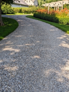 When maintaining a road it is important to ensure it has a crowned driving surface and a shoulder area that slopes directly away from the edge for water drainage.