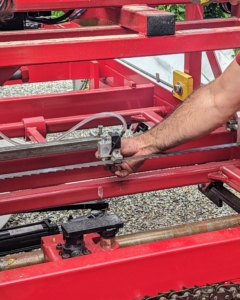 Here, the blade is adjusted to the desired position and measurement and checked several times before it cuts. Remember the old adage, "measure twice (or multiple times) and cut once."