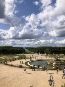 This is called Latona's Fountain and Parterre. The Latona fountain was built for Louis XIV. He wanted a fountain telling the story of the childhood of Apollo, the sun god he selected for his emblem. It went through several stages before it acquired its present form.