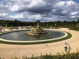 Here is a closer look at the fountain. From 1687 to 1689, Jules Hardouin-Mansart created the present fountain by turning Latona around and placing her on the top of a marble pyramid. At the base are 20 frogs cast in lead which run water towards the center of the basin.