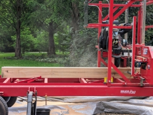 Pete is using this sawmill to cut the wood down to size. Some time ago, I decided to gift myself with a portable sawmill, so I could cut the lumber right here at the farm when needed. It's a Hud-Son H360 Hydraulic Portable Sawmill.