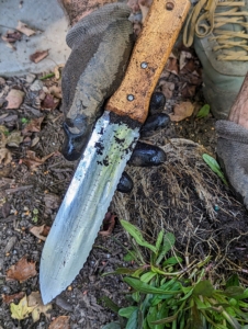 This is a Hori Hori gardening knife. It is perfect for many tasks such as loosening soil, measuring soil depth, digging up weeds, and dividing plants.