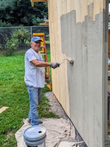Fernando Ferrari has been working with me a long time. He does a lot of the painting here at the farm. Our favorite color - Bedford Gray, of course. Here he is stating on the back of the coop's exterior walls.
