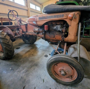 I keep this vintage Allis-Chalmers tractor from the 1940s in this barn also. It reminds us how much these farm pieces have evolved over the years.