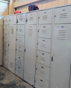 In the back corner, we have this bank of lockers for the crew. Everyone has their own set of lockers where they can store safety equipment, extra shoes, clothing, and other personal items.