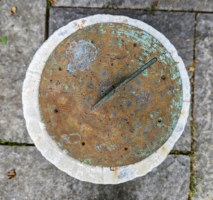 There is also this antique sundial. A sundial is any device that uses the sun’s altitude or azimuth to show the time. It consists of a flat plate, which is the dial, and a gnomon, which casts a shadow onto the dial.