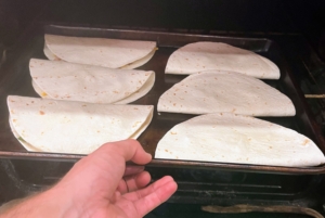 The filled tortillas are then put into the broiler's top rack until they are browned - about 2 to 3 minutes per side depending on the broiler.