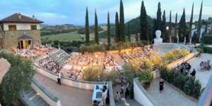 The celebration was held in the amphitheater of Brunello's brand Umbrian home in the hamlet of Solomeo. The cypress trees in the background - all restored by Brunello.
