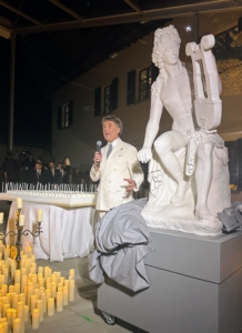 Brunello's daughter gifted him with a statue of Apollo playing a lyre. It was presented with the enormous birthday cake on the left with 70 candles.