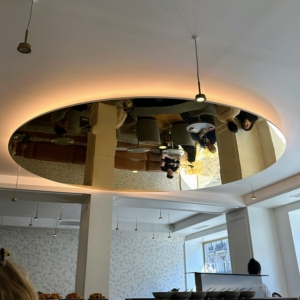 Mirrors on the ceiling allow one to see behind the counter, where many of Cédric's creations are prepared.