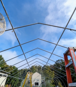 Here is the hoop house without its skin. The skin covers a frame built using heavy gauge American made, triple-galvanized steel tubing. I chose this gothic style because of its high peak to accommodate my taller plants.