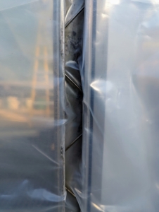 These three and four foot long spring wires compress and elongate when installed within the metal channels. They are installed all around the structure.