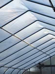 Once it is turned on, the space between the two layers of plastic fills with air to keep the hoop house warm and insulated. The air layer prevents heat loss at half the rate of single-paned glass.