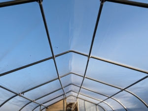 The space between the two layers of plastic will be filled with air to keep the hoop house taut, smooth, and insulated. The air layer prevents heat loss at half the rate of single-paned glass.
