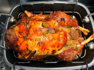 Here's the turkey. "The turkey was a little crispy on the outside but moist and juicy on the inside. My mother has always roasted her turkey breast down for most of the cooking and then we flip the bird over the last hour and it always comes out beautiful!"